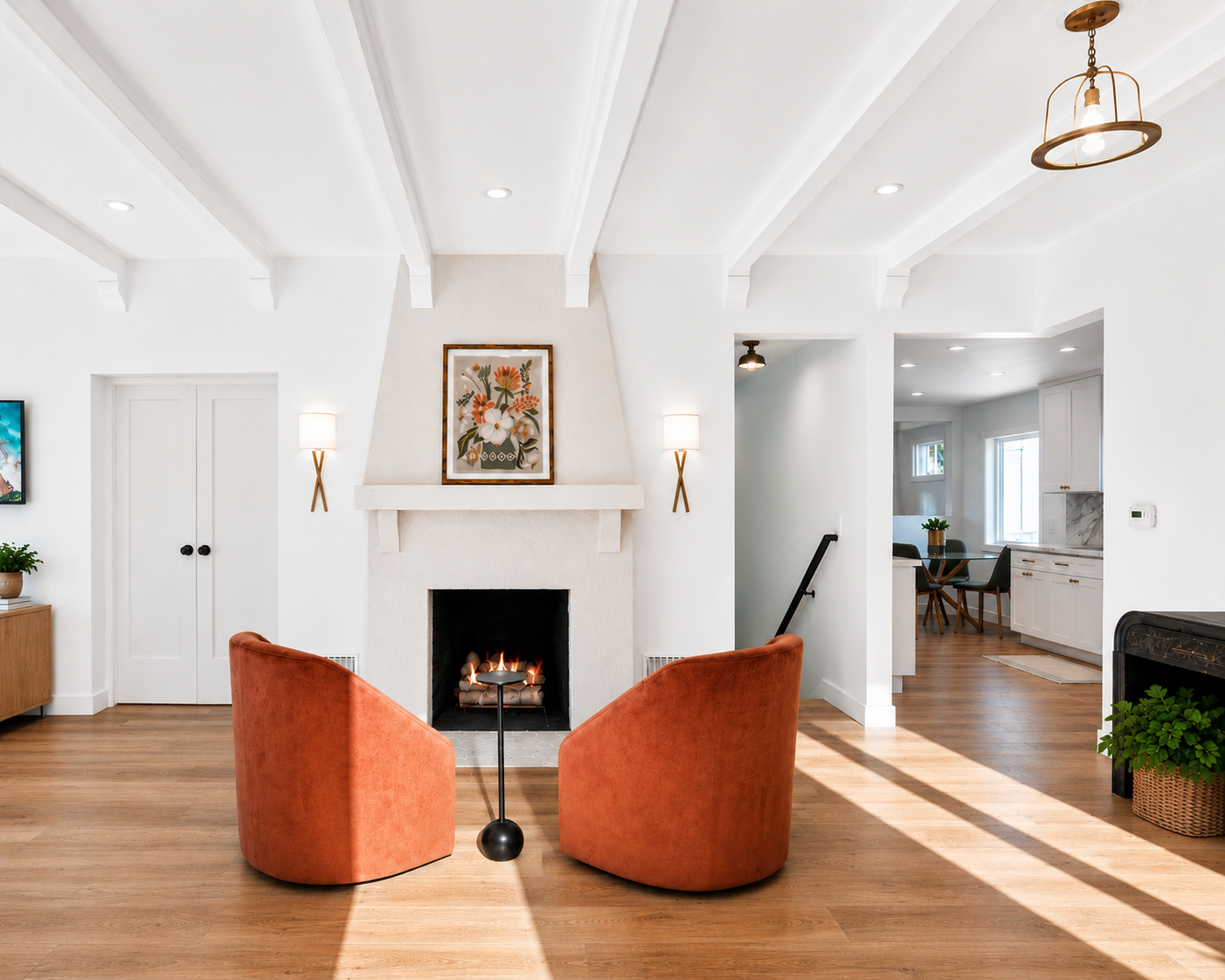 Renovated dining room with preserved architectural character, terracotta accents, and new wide-plank oak floors